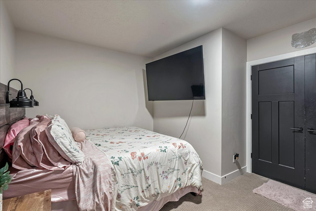 Carpeted bedroom with baseboards