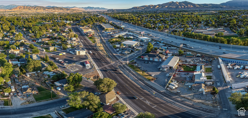 Aerial view of property\'s location featuring a highway and a mountain backdrop