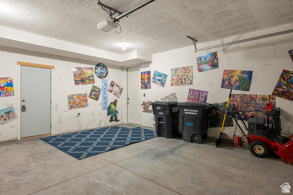 Garage featuring a garage door opener