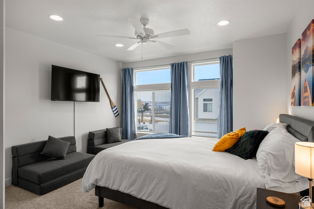 Bedroom featuring recessed lighting, ceiling fan, and carpet floors