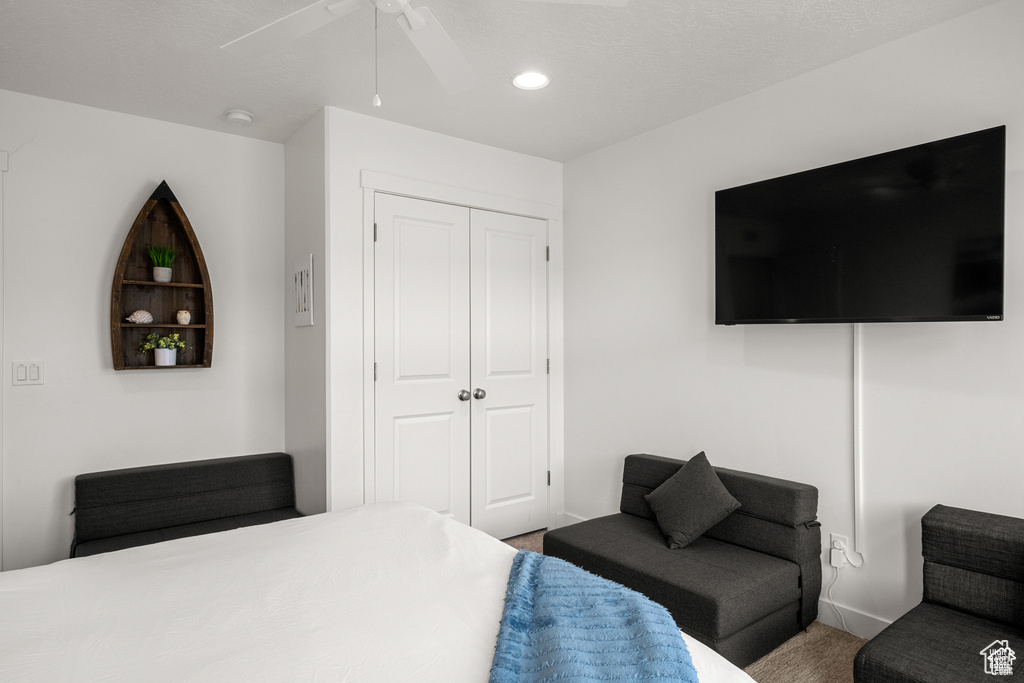 Bedroom with a closet, recessed lighting, carpet flooring, and ceiling fan