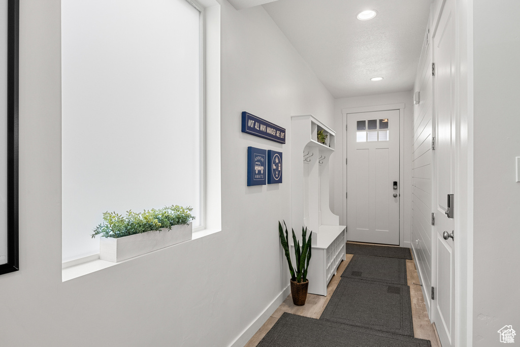 Entryway featuring baseboards and recessed lighting