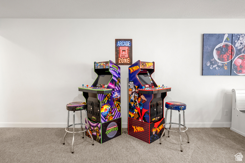 Game room featuring baseboards and carpet flooring