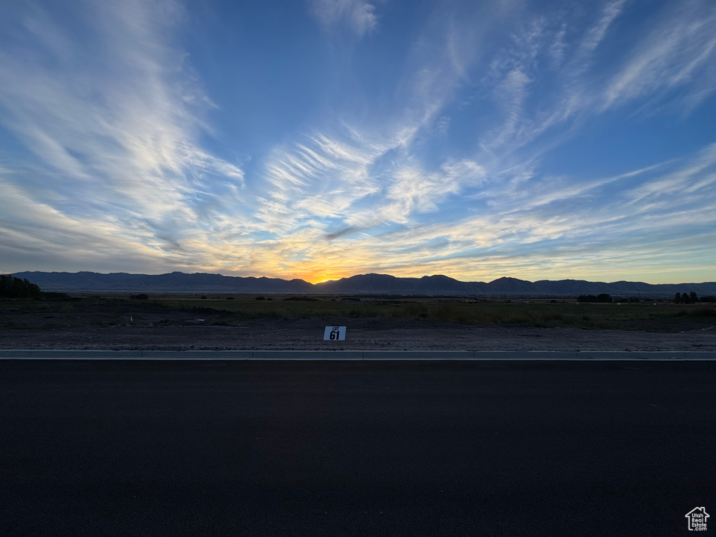 View of mountain backdrop with rural landscape