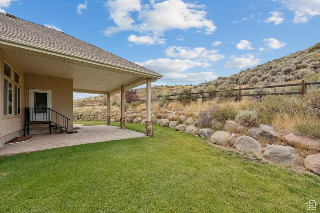 View of yard with a patio area and a mountain view