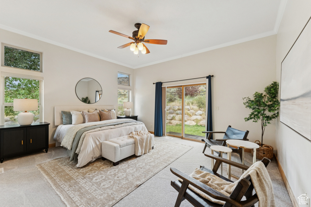 Bedroom with ornamental molding, carpet, access to exterior, and a ceiling fan