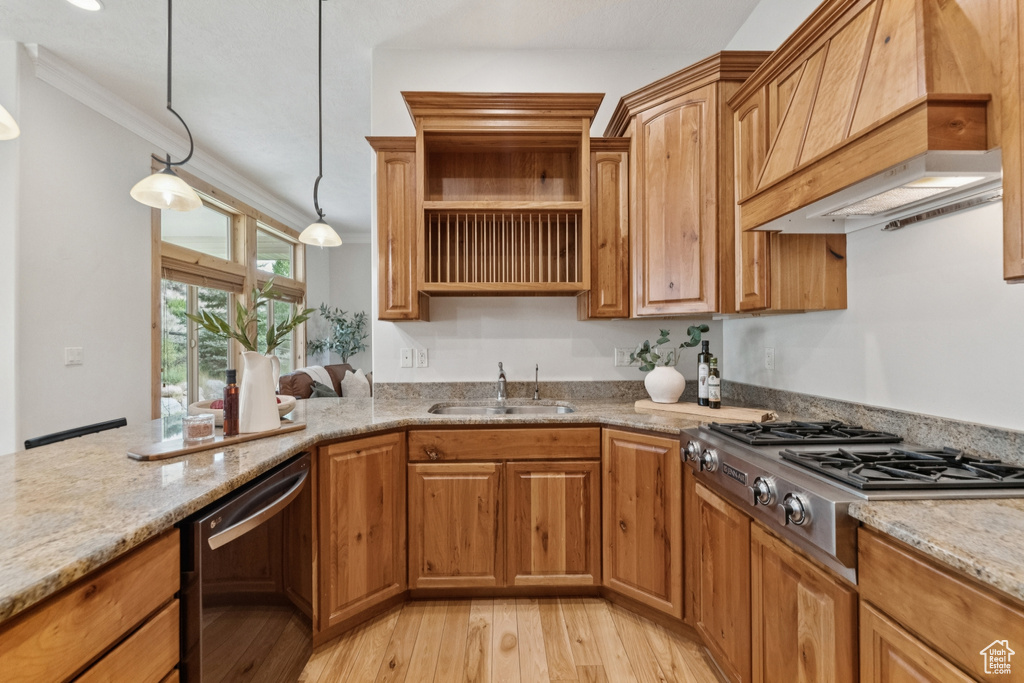Kitchen featuring light stone counters, open shelves, dishwasher, light wood-style flooring, and stainless steel gas cooktop