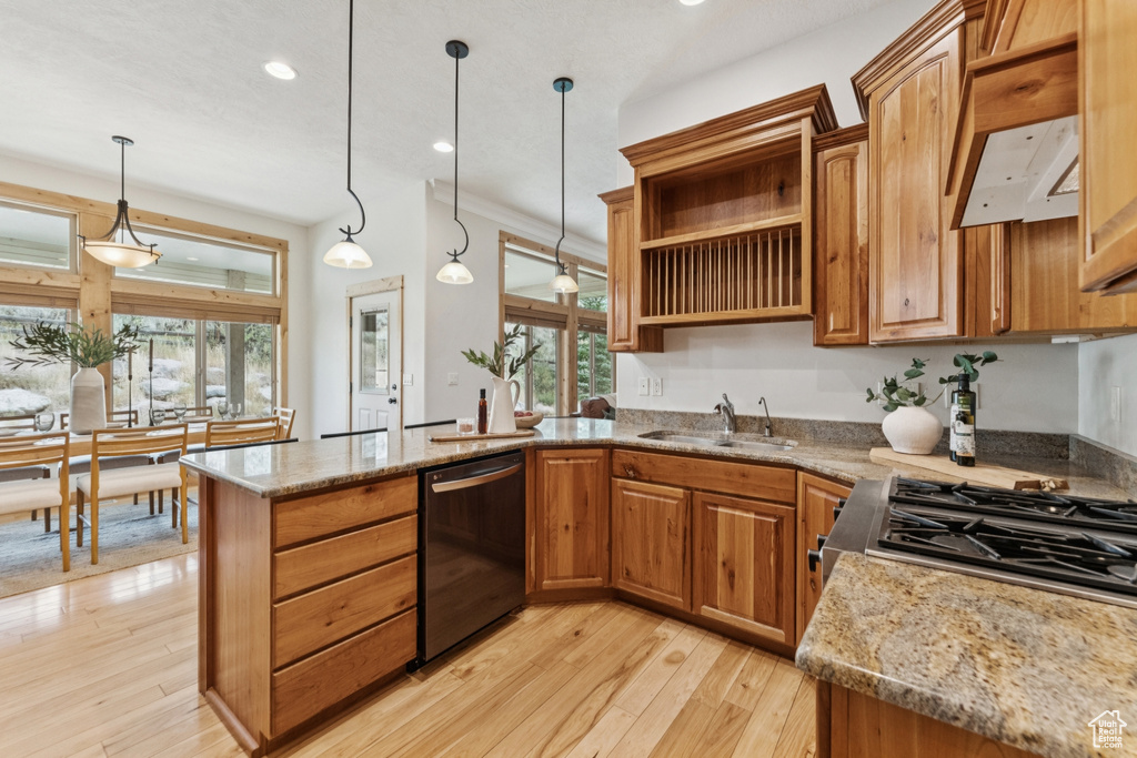 Kitchen with open shelves, brown cabinetry, light stone countertops, decorative light fixtures, and recessed lighting