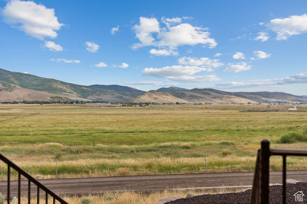 View of mountain backdrop featuring rural landscape