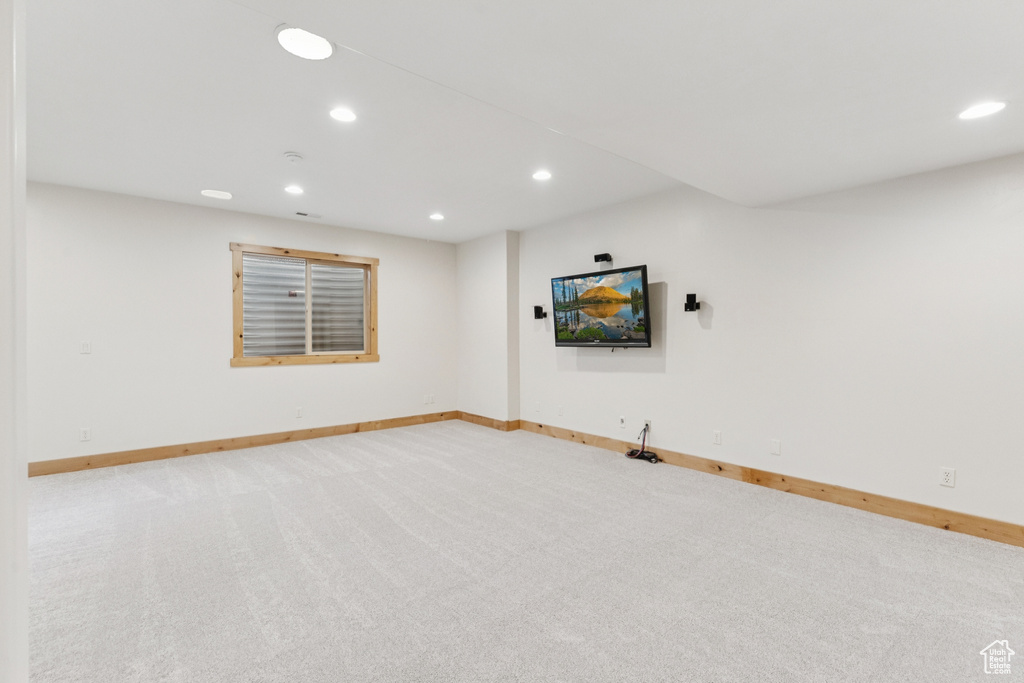 Basement featuring recessed lighting and light carpet