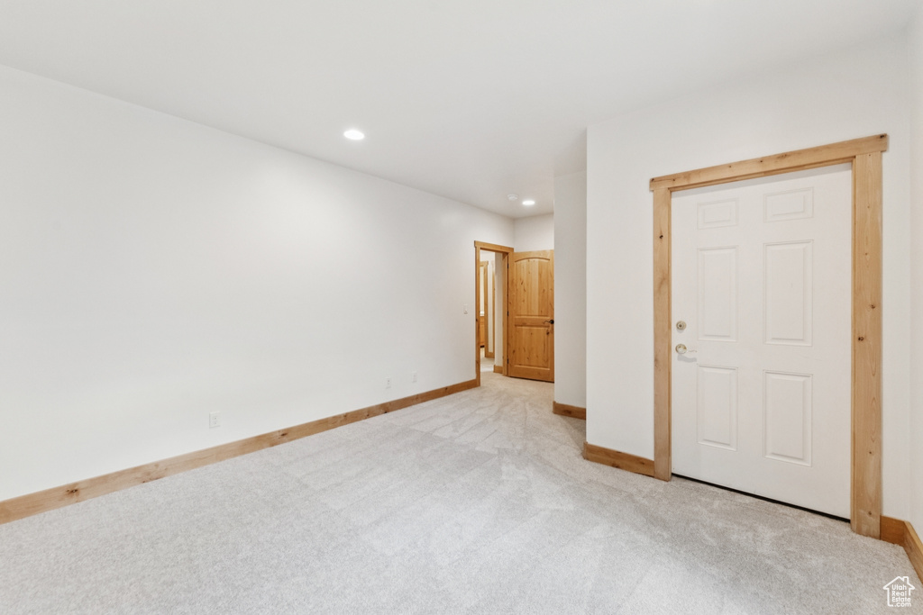 Unfurnished bedroom featuring light colored carpet and recessed lighting