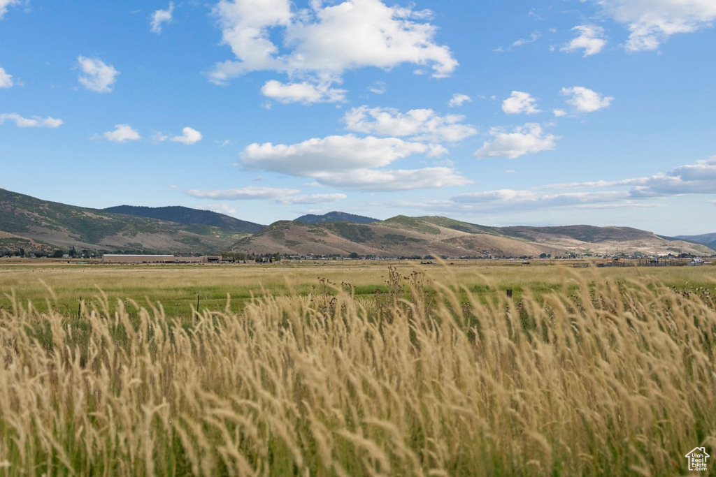 View of mountain background featuring rural landscape