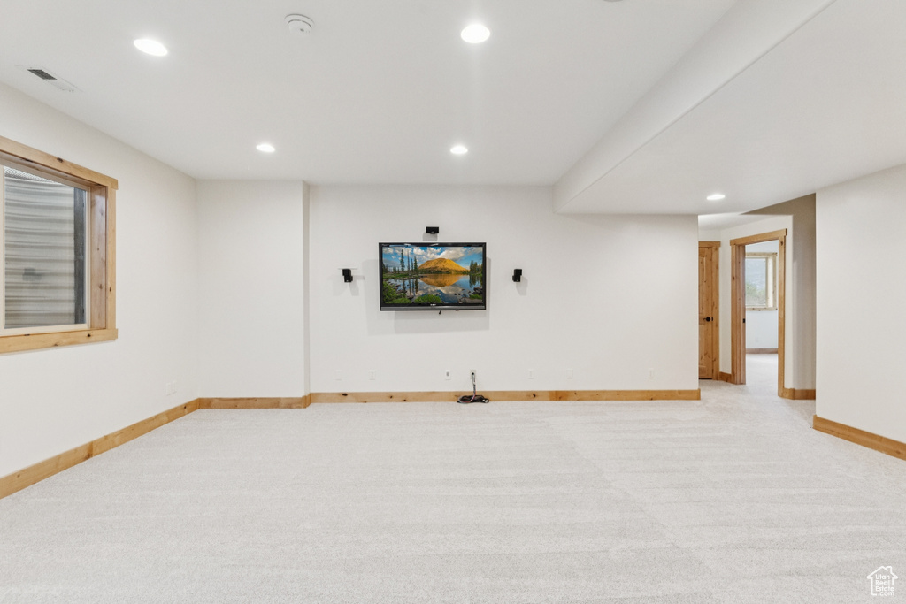 Below grade area featuring light carpet and recessed lighting