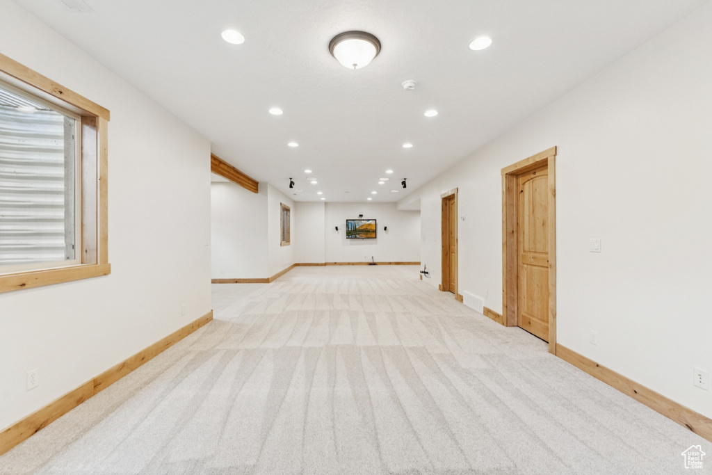 Spare room with recessed lighting and light colored carpet