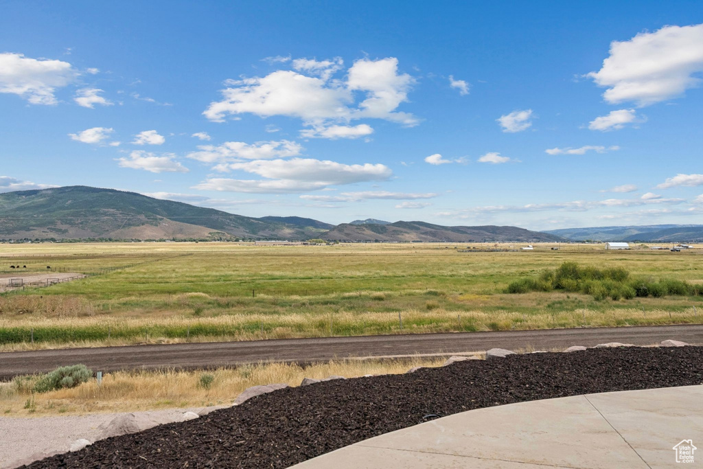 View of mountain background featuring rural landscape