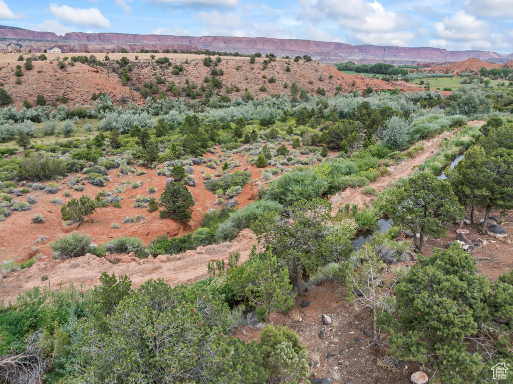 Aerial view of property\'s location featuring a mountain backdrop and rural landscape