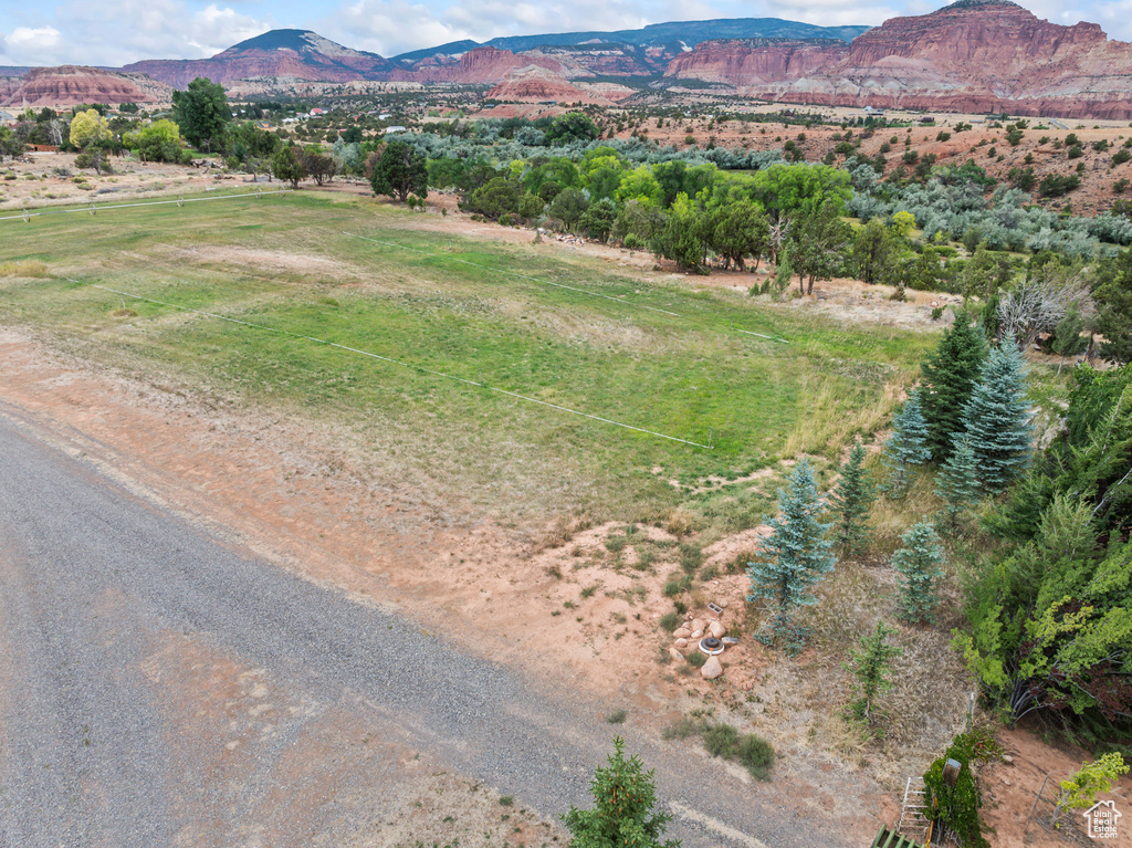 Aerial view of sparsely populated area featuring a mountainous background