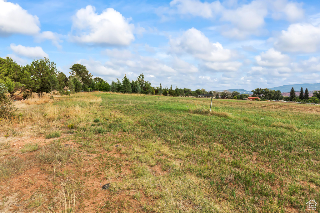 View of undeveloped land with rural landscape and mountains