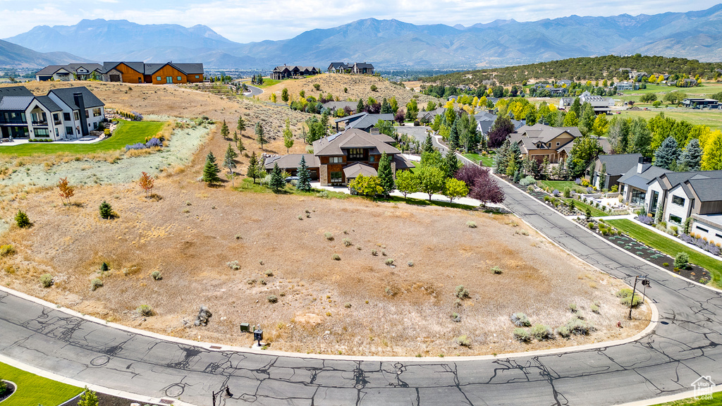 Aerial perspective of suburban area with a mountain backdrop