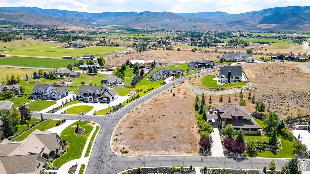 Aerial view of residential area with a mountainous background