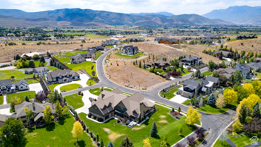 Aerial perspective of suburban area featuring a mountain backdrop