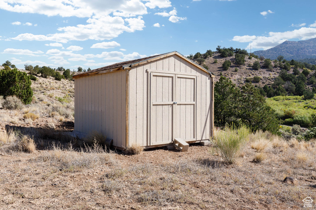 View of shed with a mountain view