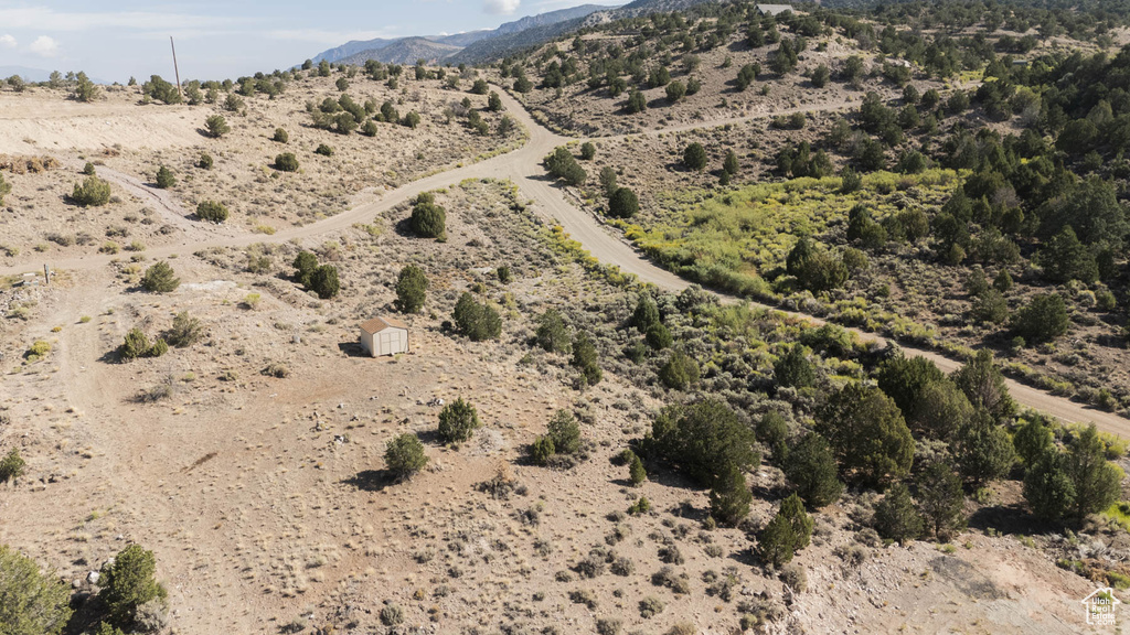 View of rural area with a desert landscape and a mountain backdrop