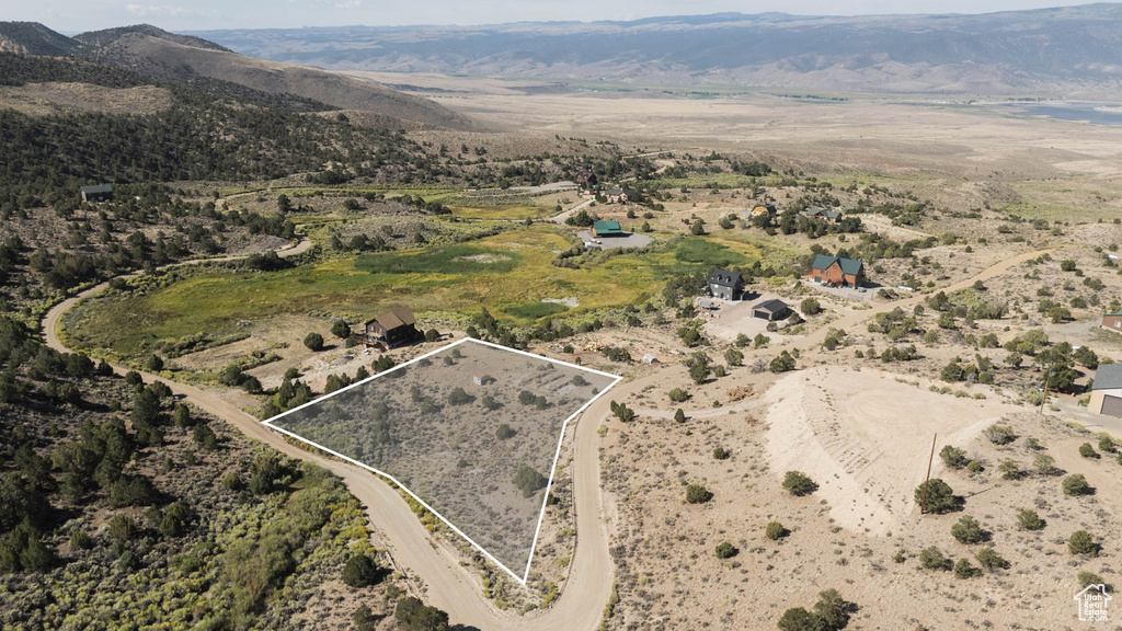 Aerial view of property\'s location featuring property boundaries highlighted and mountains