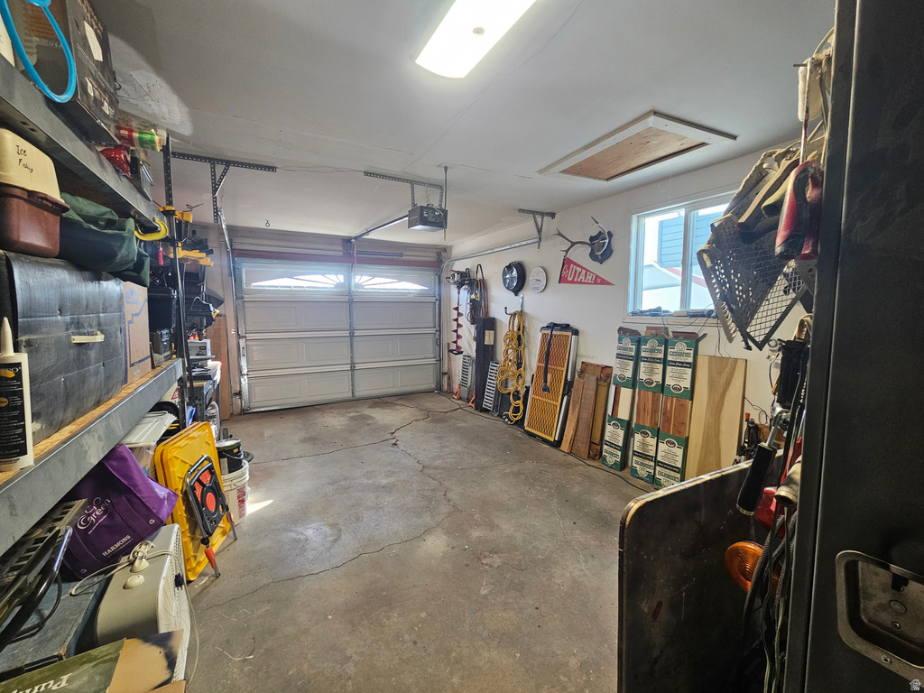 Garage featuring a garage door opener