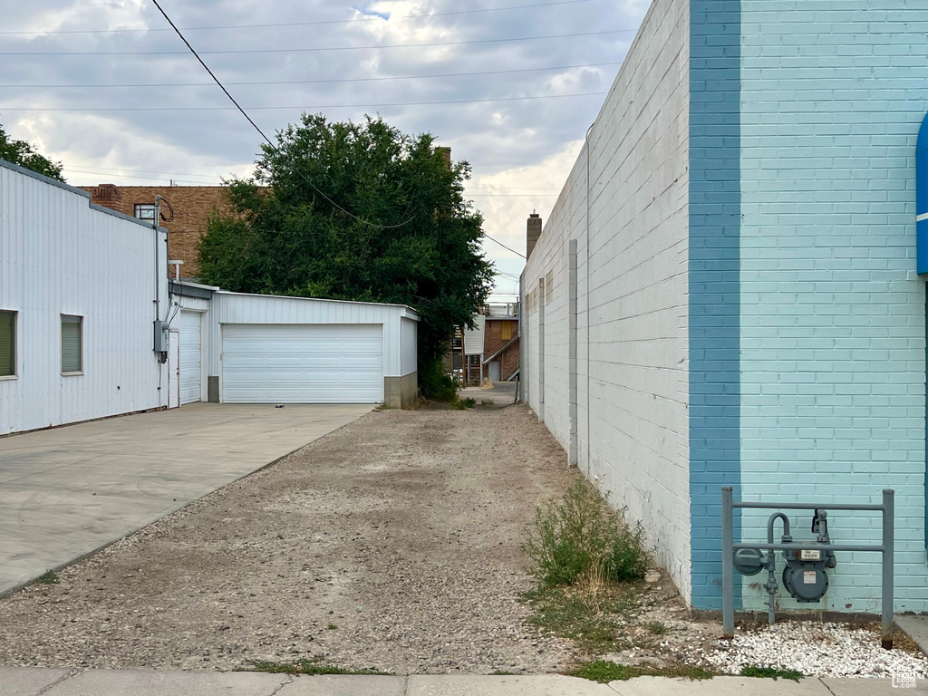 View of property exterior with a garage