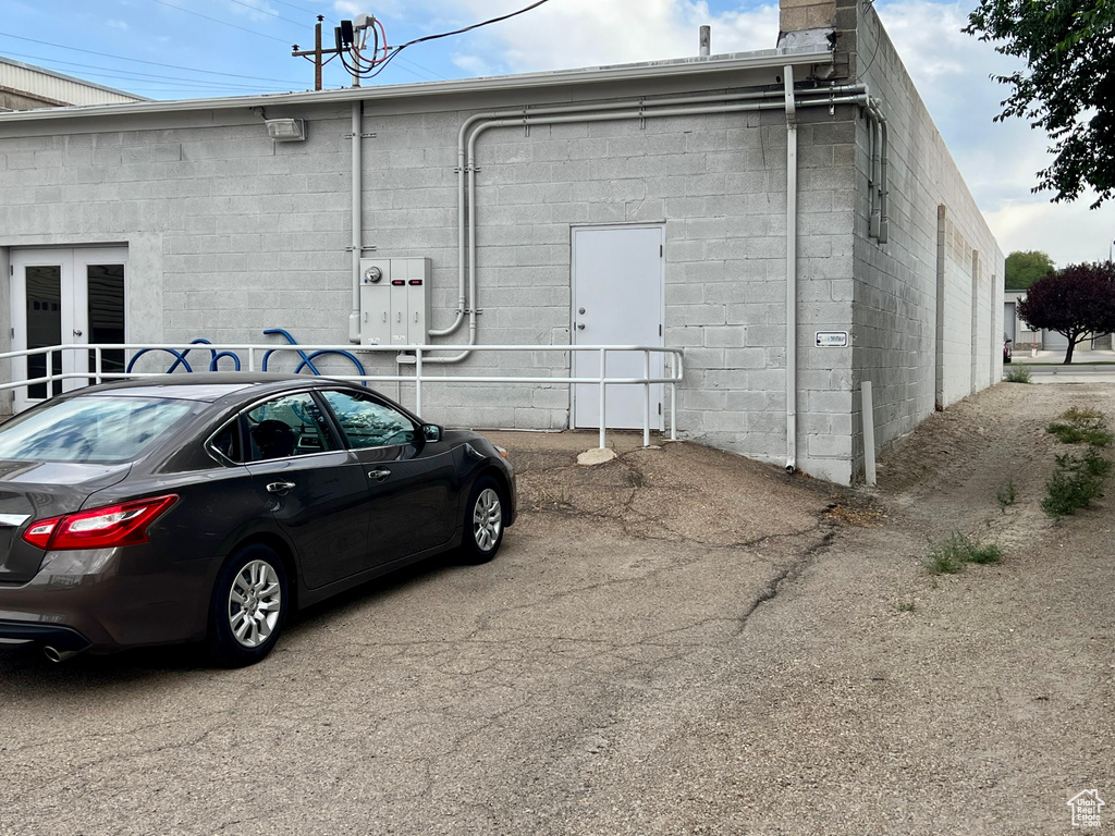 View of property exterior with concrete block siding