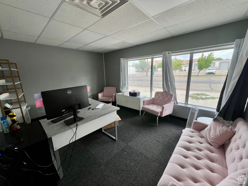 Office with a paneled ceiling