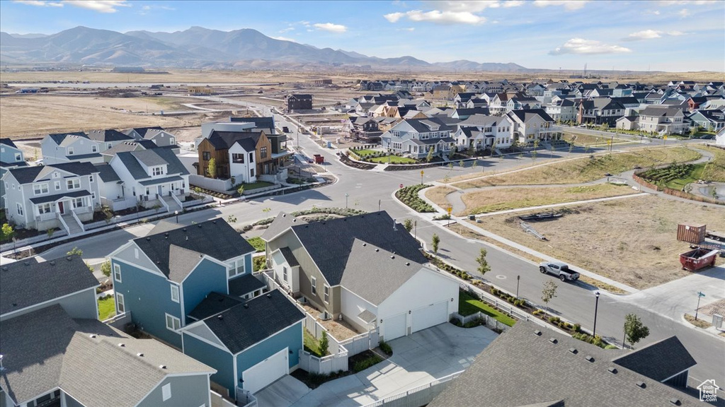 Aerial view of residential area with a mountainous background