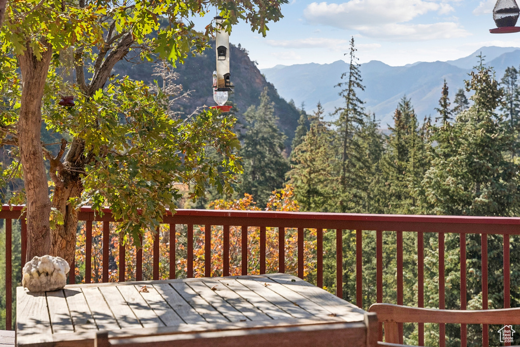 Wooden terrace featuring a mountain view
