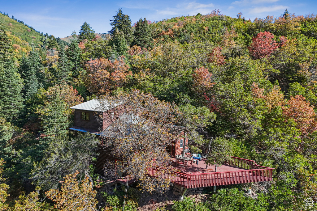 View from above of property with a heavily wooded area