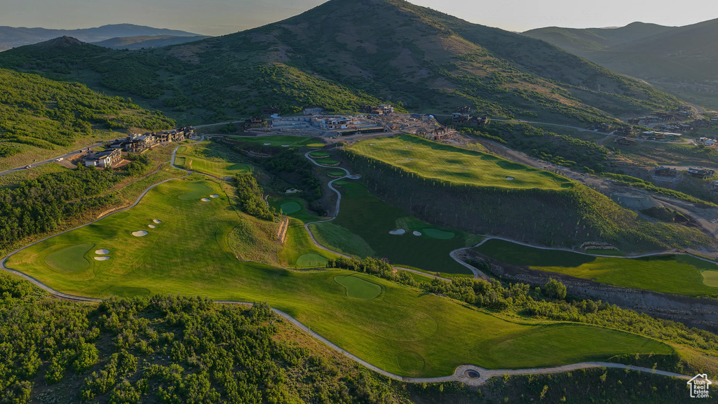 Aerial view of property\'s location featuring a golf club and a water and mountain view