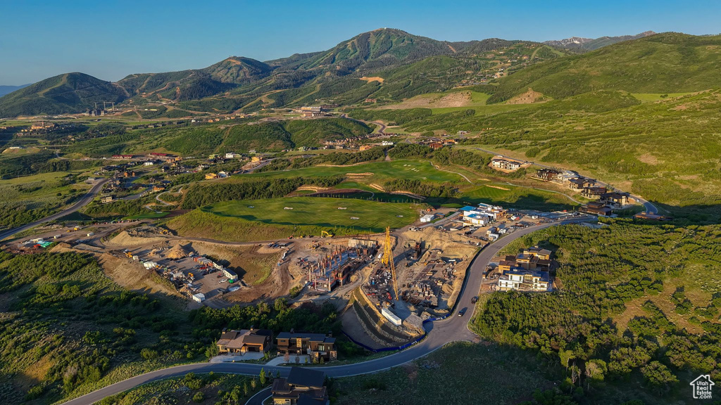 Aerial view of property\'s location with a mountain backdrop