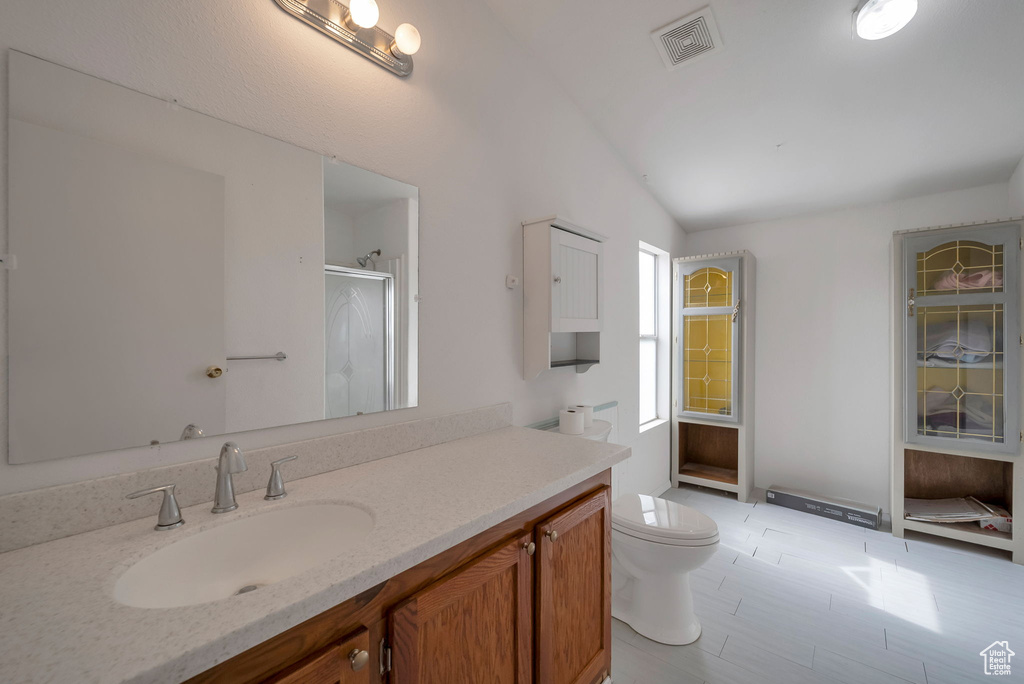 Full bath featuring vanity and a stall shower