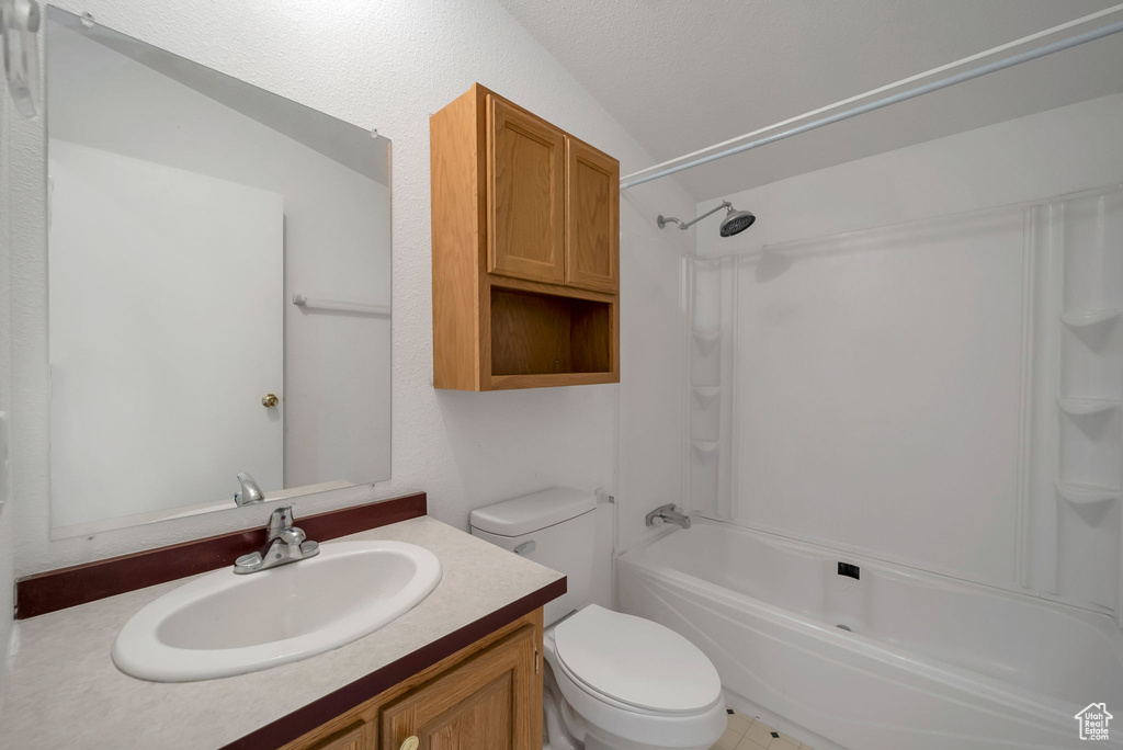 Full bath featuring tub / shower combination and vanity