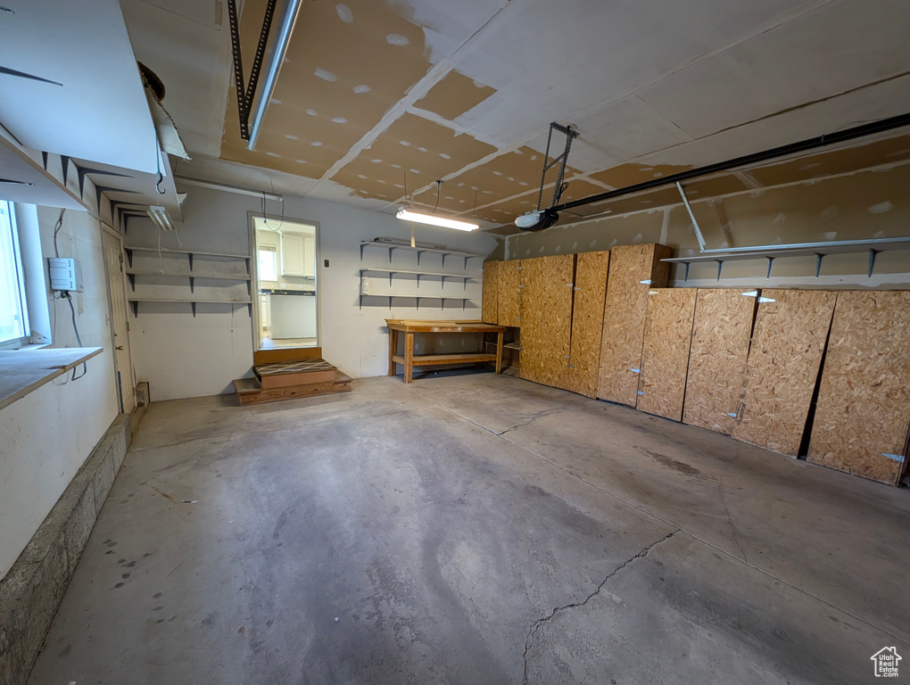 Garage featuring a garage door opener