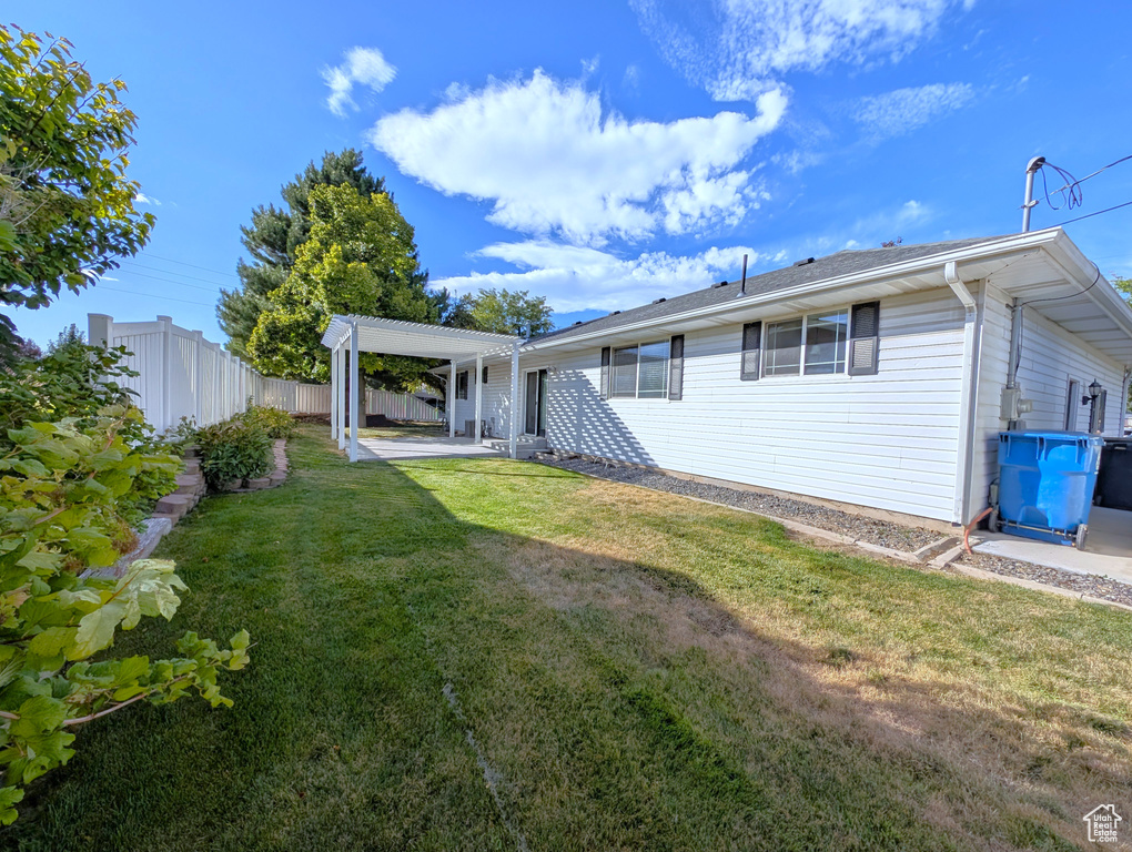 Back of property with a patio and a pergola