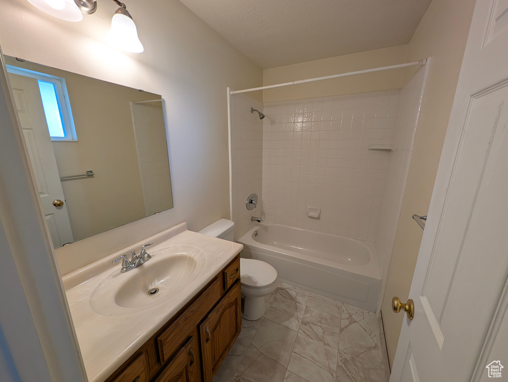 Bathroom featuring washtub / shower combination and vanity