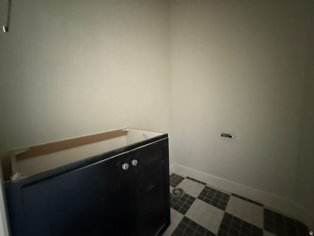 Laundry room featuring baseboards