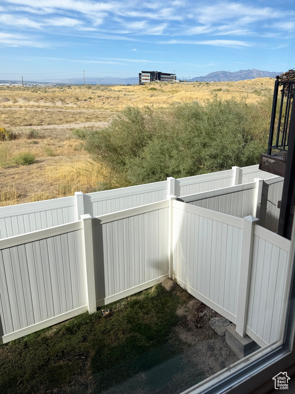 View of yard featuring a view of rural / pastoral area and a mountain view