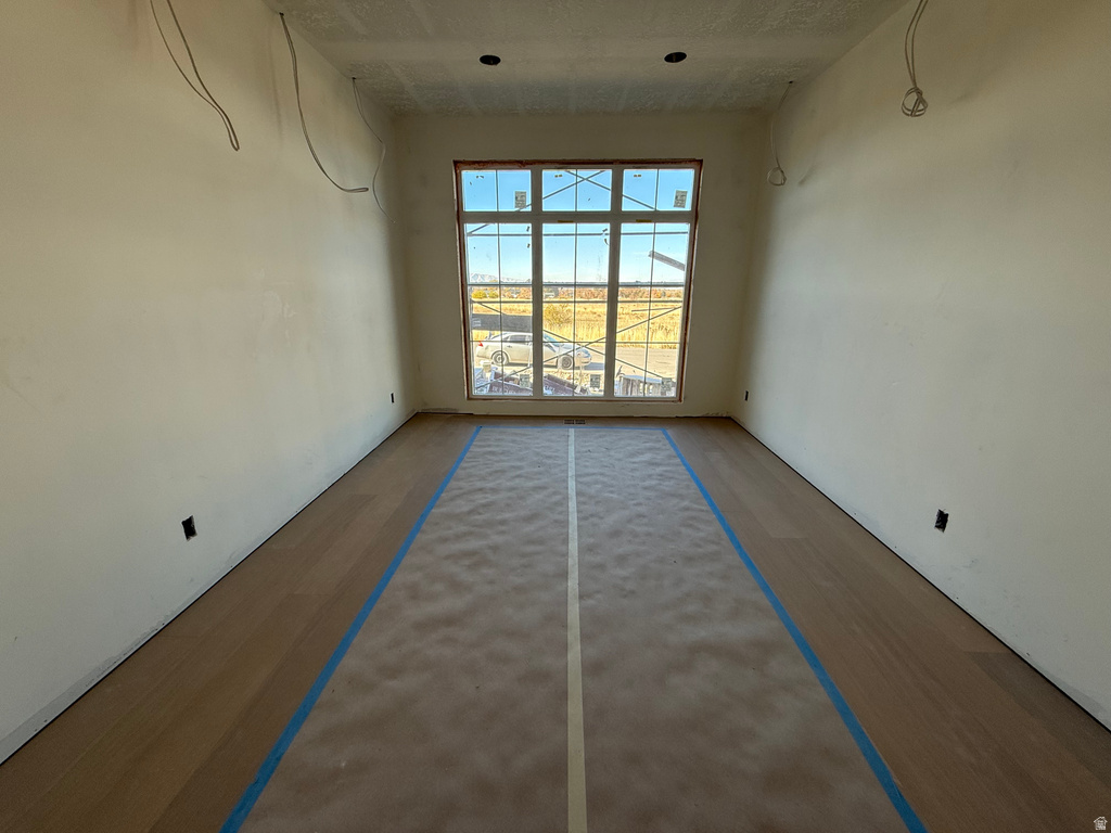 Spare room featuring wood finished floors