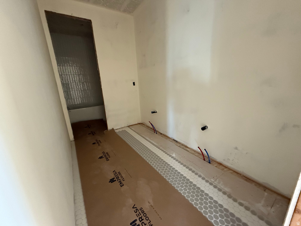 Full bathroom with a tub to relax in