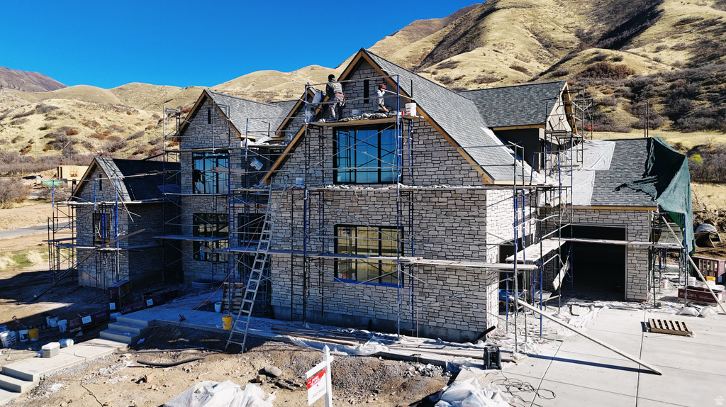 View of front of home with a mountain view
