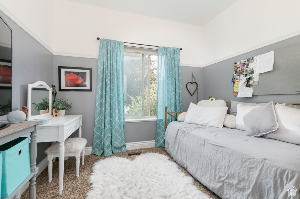 Carpeted bedroom with baseboards