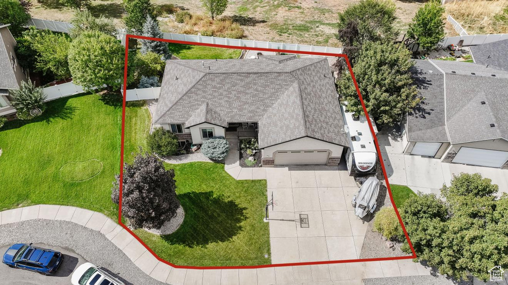 Aerial view of property and surrounding area featuring property parcel outlined