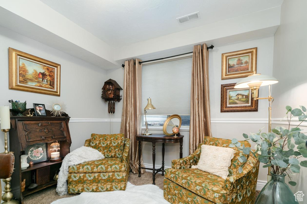 Living area featuring carpet flooring